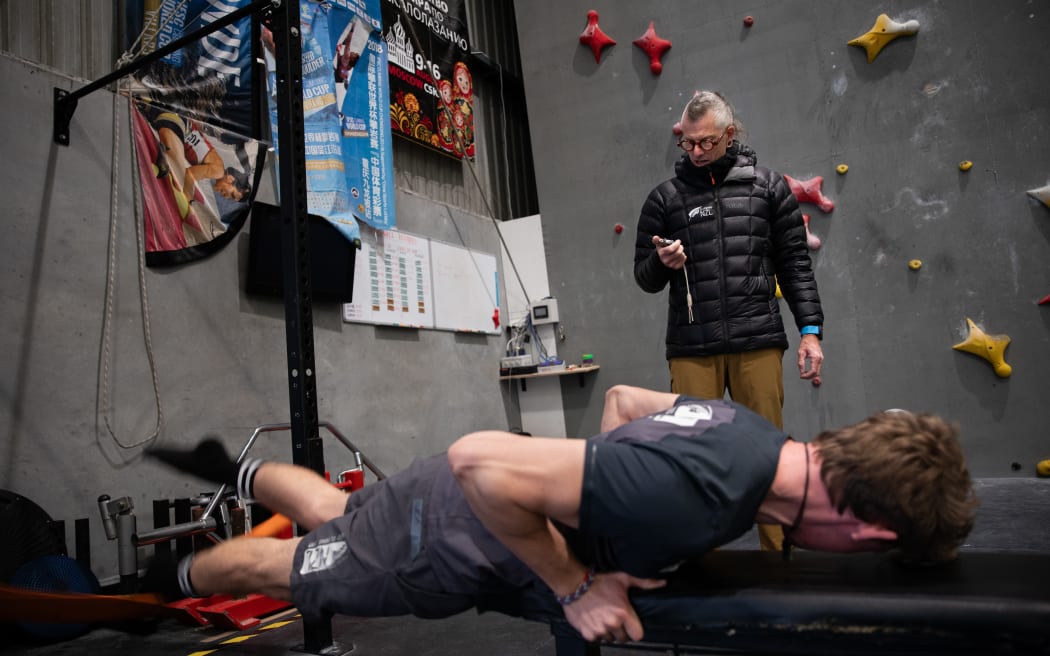 Climbing NZ High Performance Director Rob Moore goes through a training drill with speedclimber Julian David.