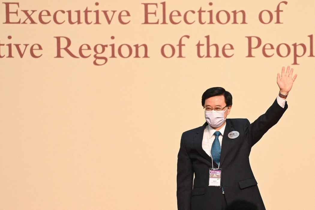 John Lee waves after becoming the city's new chief executive in Hong Kong on May 8, 2022.