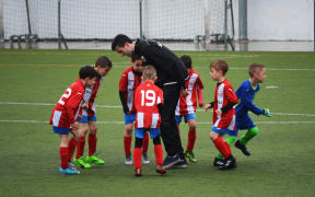 children play soccer