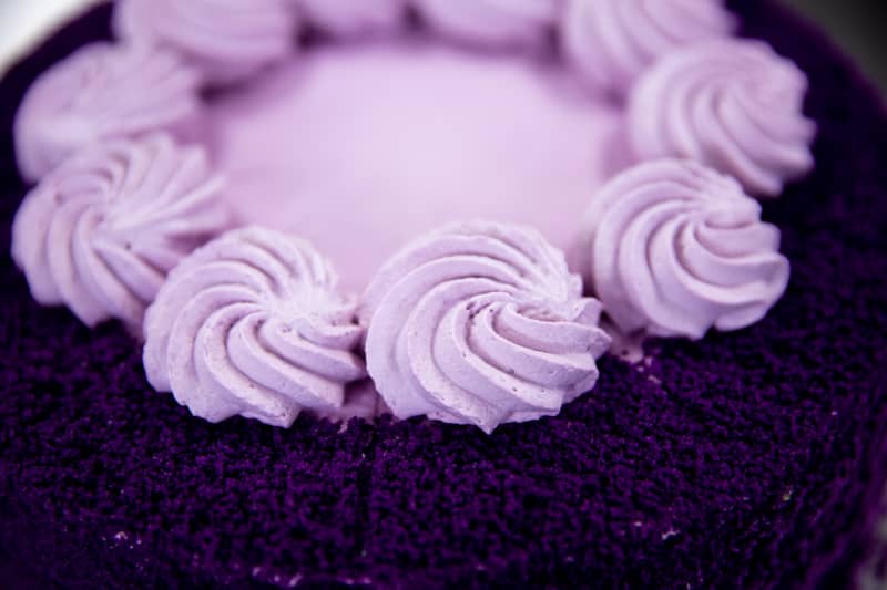 A close-up picture of an ube cake.