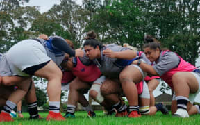 The Manusina women's rugby team pack down a scrum in training.