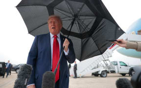 US President Donald Trump speaks to the press before boarding Air Force One for a trip to the Middle East on 12 October 2025 at Joint Base Andrews, Maryland.