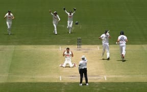 ADELAIDE, AUSTRALIA - DECEMBER 21: Pat Cummins of Australia appeals for the dismissal of Brydon Carse and after a review it was ruled not out during day five of the Third Test Match in the 2025-26 Ashes Series between Australia and England at Adelaide Oval on December 21, 2025 in Adelaide, Australia. (Photo by Philip Brown/Getty Images)
