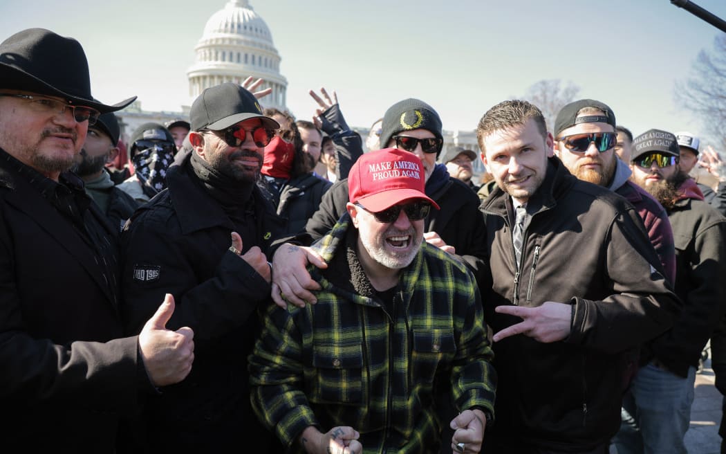 WASHINGTON, DC - FEBRUARY 21: (L-R) Stewart Rhodes, Enrique Tarrio, Joe Biggs and Zach Rehl, members of the far-right group the Proud Boys, rally outside the U.S. Capitol following a news conference on February 21, 2025 in Washington, DC. The news conference was held in the same area where thousands of supporters of President Donald Trump attacked the U.S. Capitol on January 06, 2021 in an attempt to halt the certification of former President Joe Biden's election victory. In one of the first acts of his second term, Trump pardoned nearly 1,600 people charged and convicted of crimes related to the assault.   Chip Somodevilla/Getty Images/AFP (Photo by CHIP SOMODEVILLA / GETTY IMAGES NORTH AMERICA / Getty Images via AFP)
