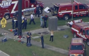 Emergency services attend the shooting in the town of Parkland in Broward County, Florida.
