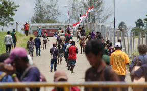 Papua New Guineans cross the Indonesian border for goods and services.