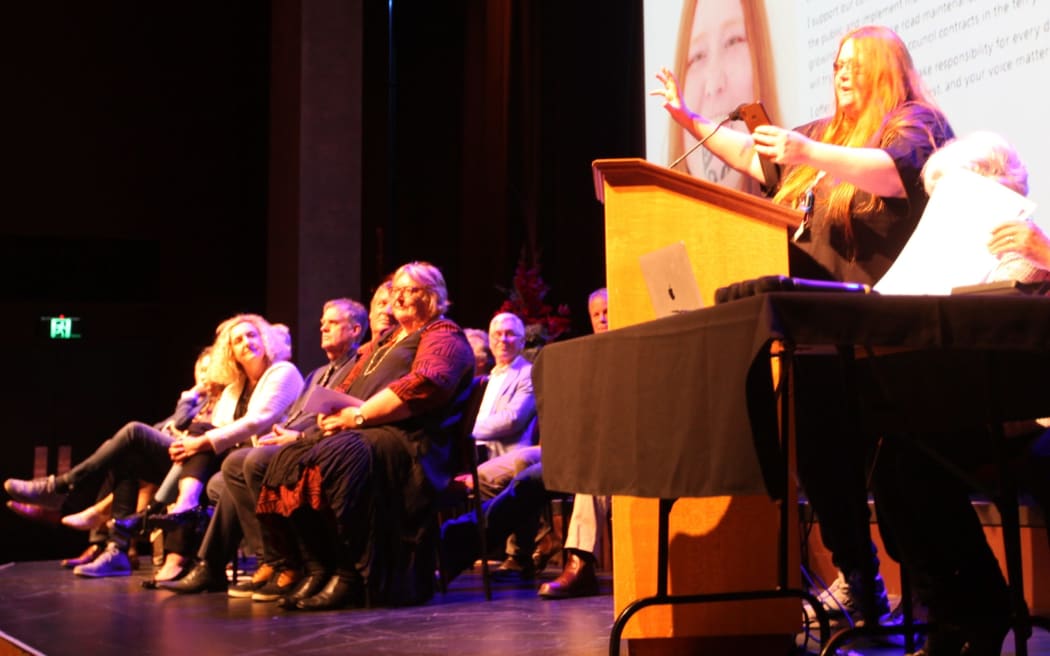Shfire Sapphire (R), who is standing for the Ashburton District Council in the October 2022 local body elections, speaks at a 'meet the candidates' event at Ashburton Event Centre.
