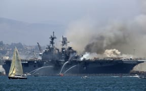 A fire burning on the USS Bonhomme Richard at Naval Base San Diego, California, 12 July 2020, California.