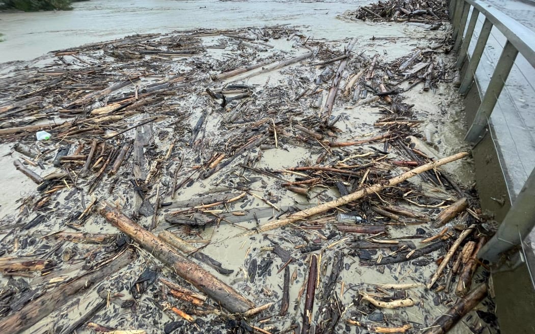 Flooding and forestry slash at Tolaga Bay on 13 February 2023, before the real brunt of Cyclone Gabrielle hit.