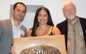 Alistar Kata holding the Spasifik Magazine Prize and Storyboard Award for Diversity Reporting, w/ Spasifik Magazine publisher Innes Logan and Pacific Media Centre Director, Professor David Robie