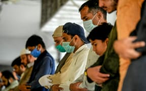 Muslims have been praying outside mosques during a government-imposed nationwide lockdown.