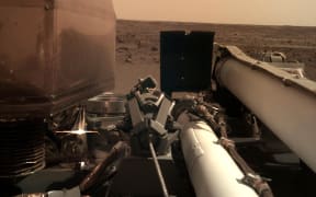 This imageshows a view from NASA's InSight lander after it touched down on the surface of Mars.