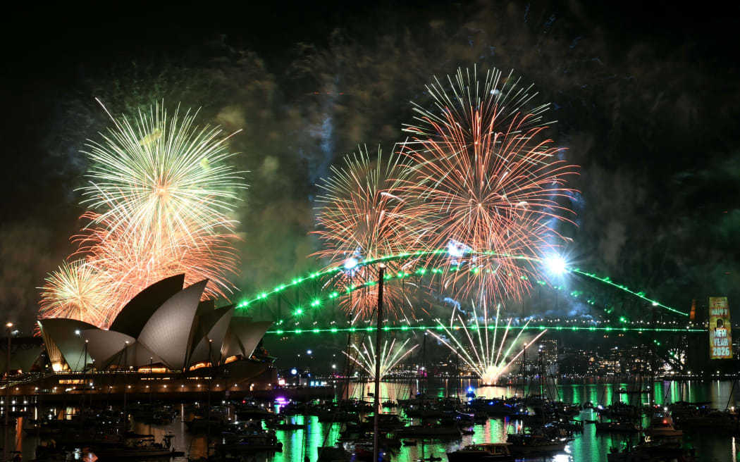 Fireworks light up the midnight sky over Sydney Harbour Bridge and Sydney Opera House during New Year’s Day celebrations in Sydney on January 1, 2026.