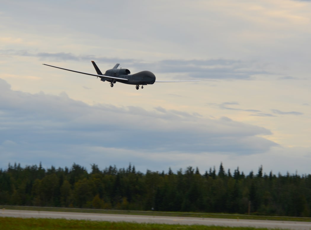 A RQ-4 Global Hawk unmanned surveillance drone lands on August 16, 2018, at Eielson Air Force Base, Alaska.