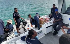 Members of the Water Police on a recent trip to Fisherman Island. They are now involved in the search for the missing four from Hanuabada.