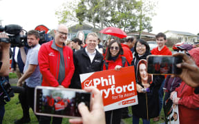 Labour's Phil Twyford and Chris Hipkins on the campaign trail in New Lynn, Auckland on 7 October 2023.