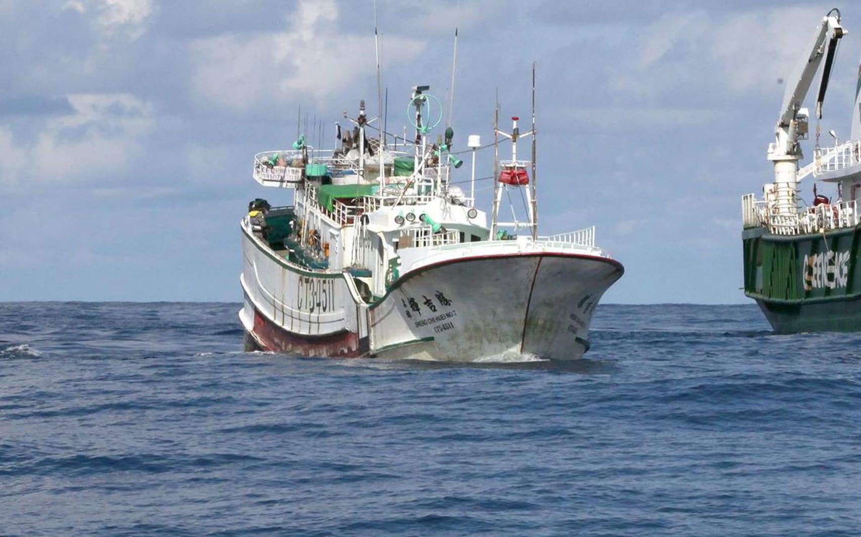A Palauan law enforcement vessel escorting a Taiwanese long line fishing vessel suspected of illegally shark finning in 2011.