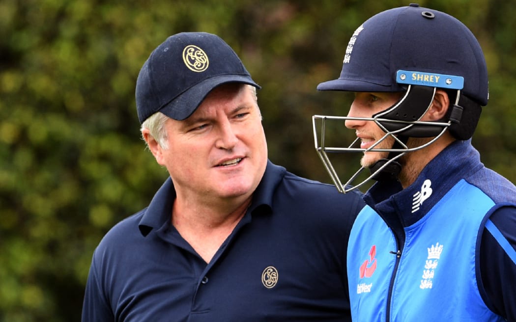 Former Australian cricketer Stuart MacGill talking to England's Joe Root.