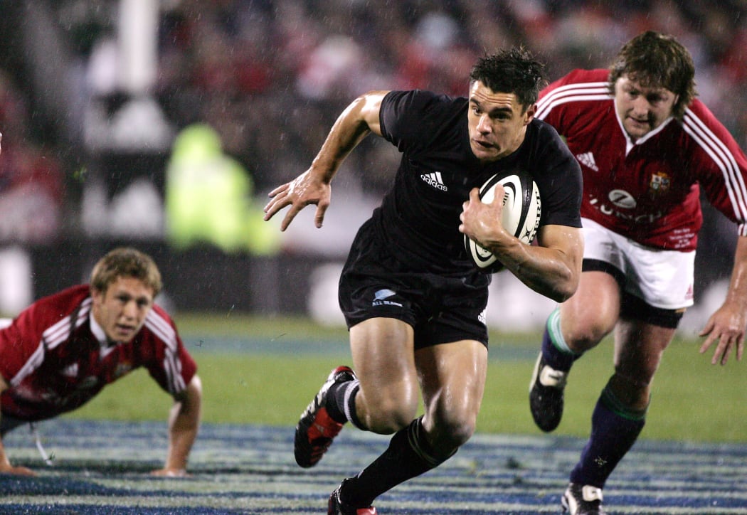 All Black Dan Carter slips the tackle of Jonny Wilkinson during the 1st test match between the New Zealand All Blacks and the British and Irish Lions at Jade Stadium in Christchurch,New Zealand in June, 2005. The All Blacks won 21-3.