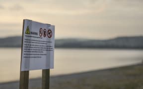 A sign warning of algal bloom in Lake Taupo