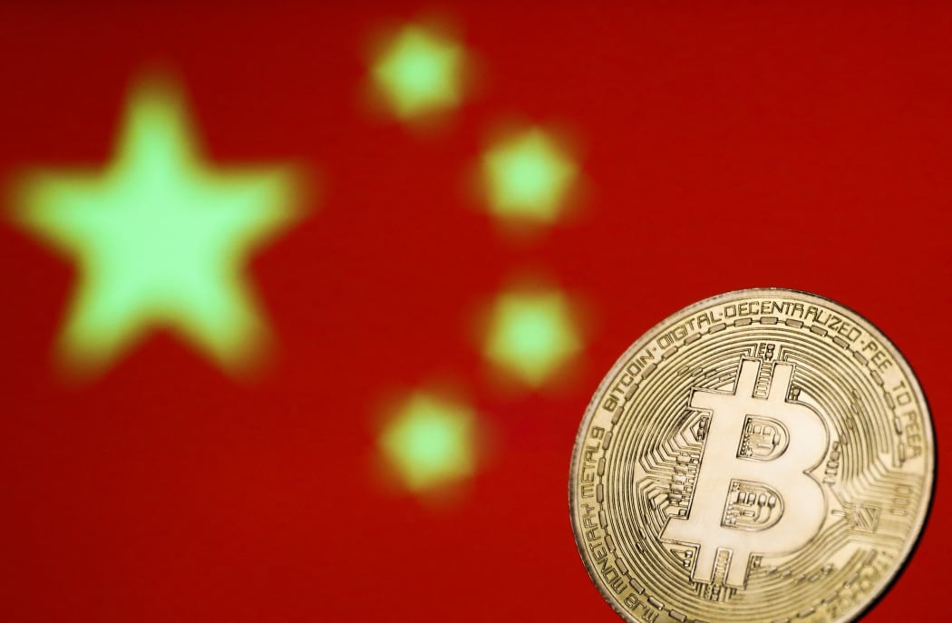 Representation of Bitcoin cryptocurrency is seen with Chinese flag in the background