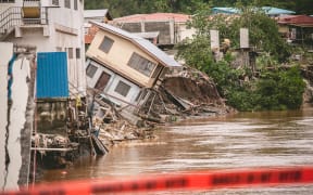 Houses teeter on the banks of the Mataniko River in Honiara.