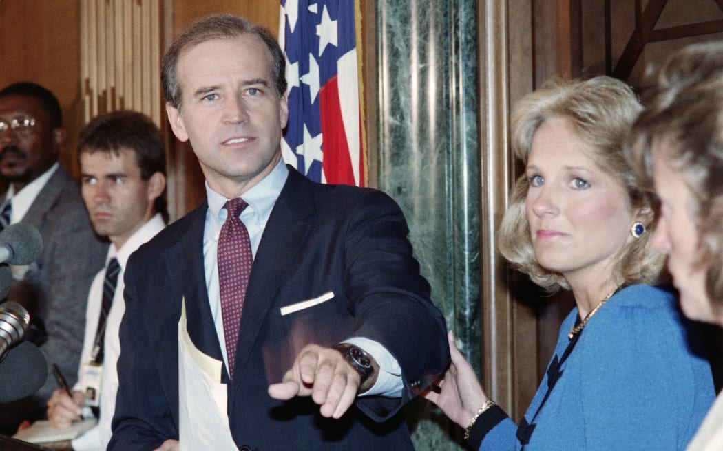 US Senator Joseph Biden, D-Del., announces on September 23, 1987 that he is withdrawing from the race for the 1988 Democratic presidential nomination, as his wife Jill grasps his arm (R).