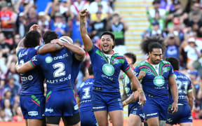 Warriors players celebrate their win.
