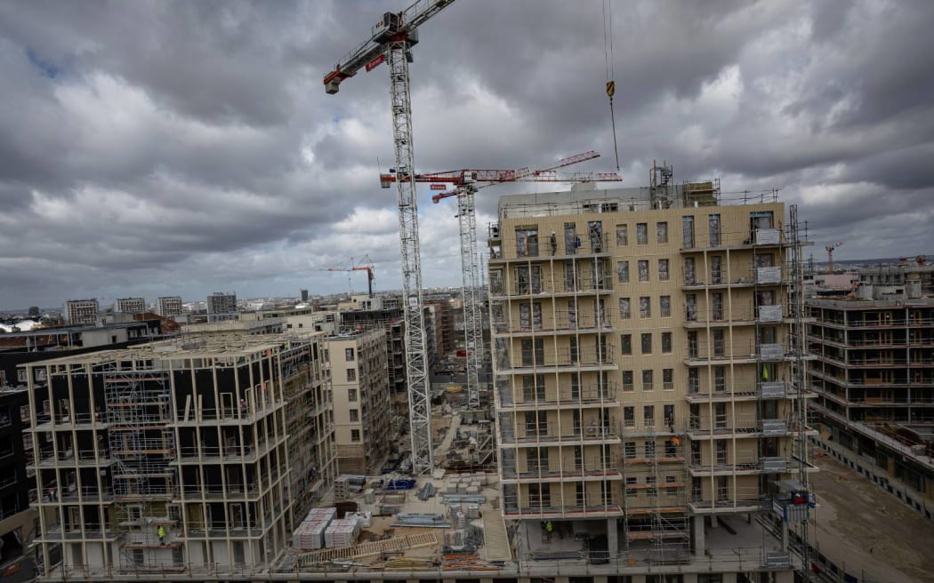 FILE - The Olympic athletes' village is under construction during a press tour in Saint Denis, outside Paris, March 24, 2023. (AP Photo/Aurelien Morissard, File)