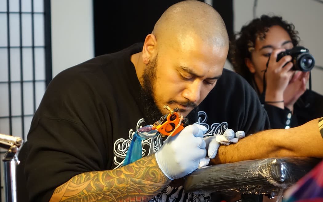 Tattoo artist Chris Amosa