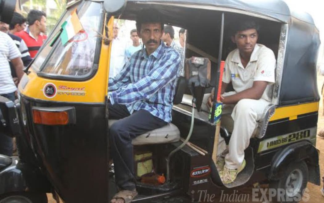 Pranav Dhanawade and his father who is a rickshaw driver.