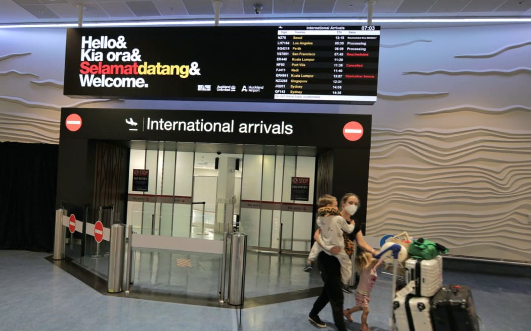 International travellers arrive in New Zealand as the border re-opens to more countries from 2 May 2022.
