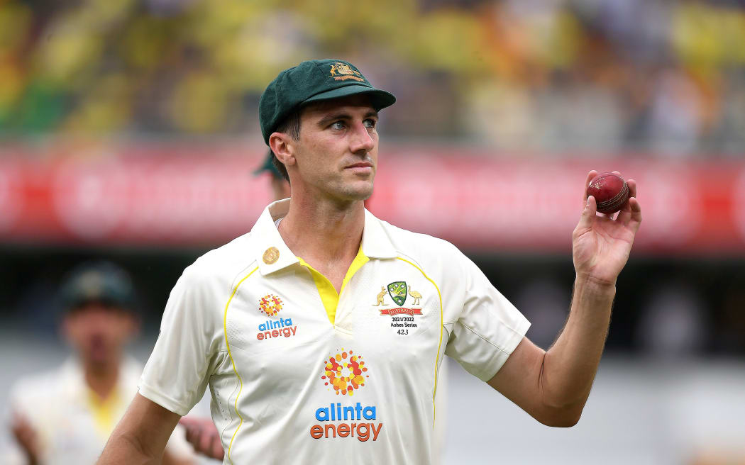 Australian bowler Pat Cummins shows the ball after taking 5 wickets on day 1 of the First Ashes Test, 2021.