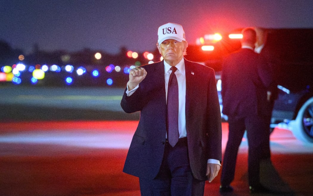 US President Donald Trump gestures as he arrives at Palm Beach International Airport, Florida, on 27 February, 2026.