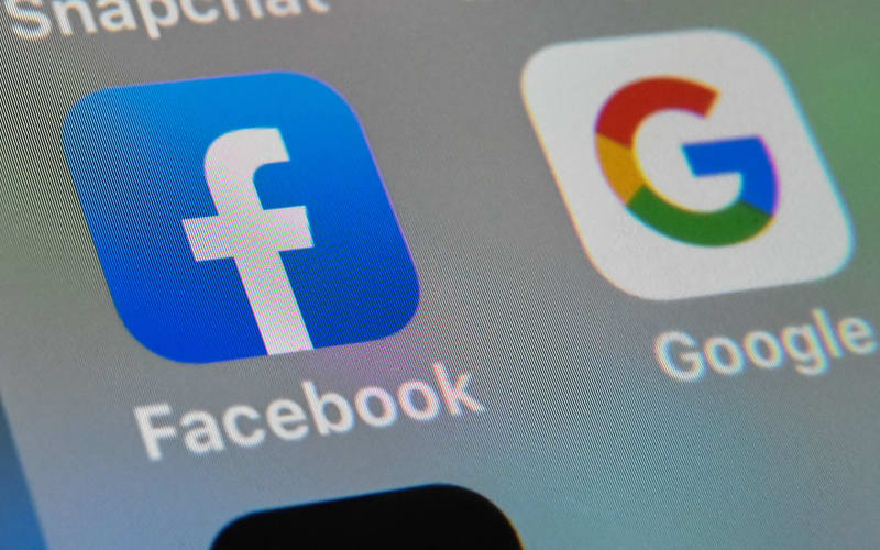 Facebook and Google apps on a a tablet.