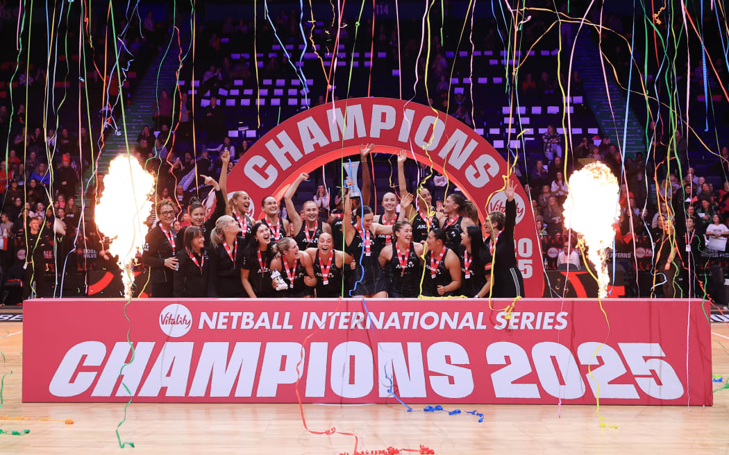 New Zealand celebrate with the trophy after their victory in Manchester, England