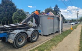 Volunteers help clear Waipara homes of belongings, furniture, and carpet contaminated by flooding during Cyclone Gabrielle.