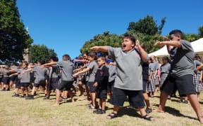 Students at Te Kura o Kokohuia perform a haka.