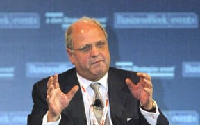 Former WTO director-general and former New Zealand prime minister, Mike Moore, gestures while speaking during a plenary session of the CEO Forum at the Grand Hyatt in Hong Kong, 06 November 2003.