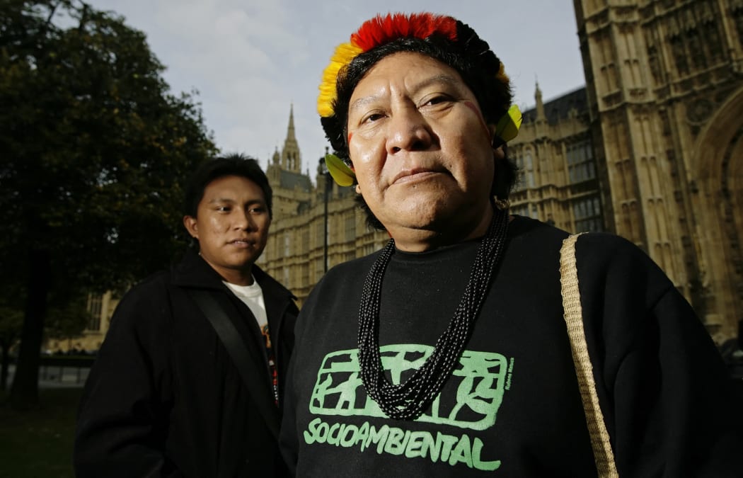 Davi Kopenawa Yanomami, (R) a renowned Indian leader from the Brazilian Amazon basin, and his son Dario Vitorio Yanomami who said the boys were playing in the river on Tuesday when they disappeared.afp