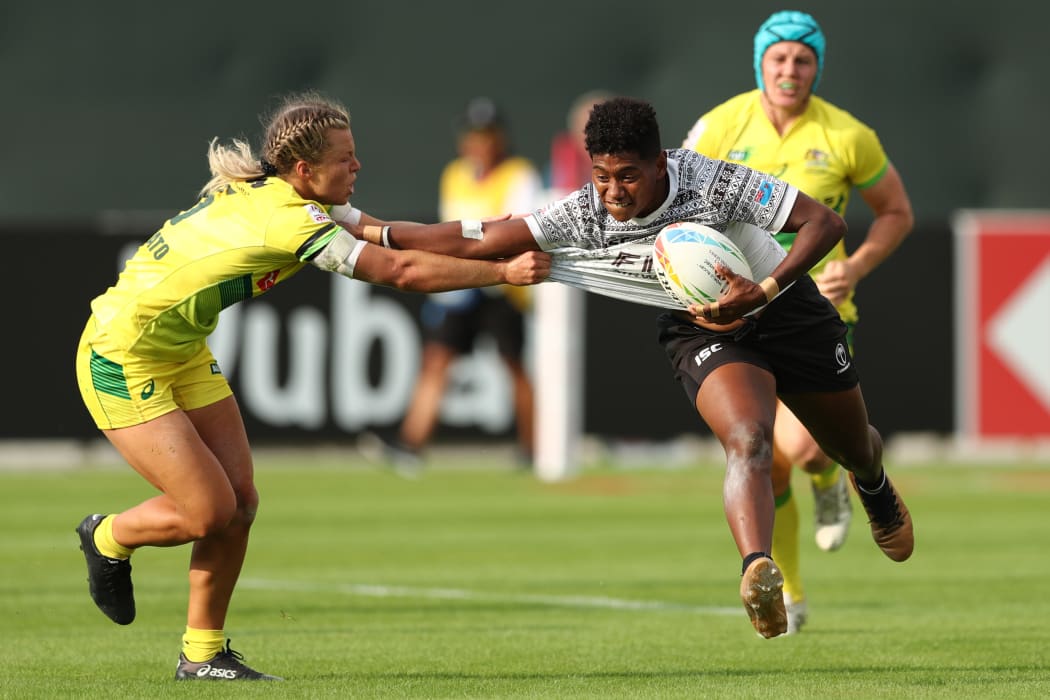 Fiji's Ana Maria Naimasi fends off the Australia defence.