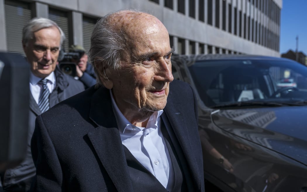 Former FIFA president Sepp Blatter arrives with his lawyer Lorenz Erni (L) to the court house in Muttenz near Basel for his trial before a special appeals court that will hear a request by the country's Attorney General's office (OAG) to reopen proceedings against Platini and former FIFA president after they were acquitted by the Swiss Federal Court in June 2022 of charges that included "disloyal management", "breach of trust" and "forgery of securities", on 3 March, 2025.