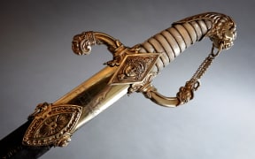 This photograph taken in Paris on April 25, 2025 shows details of the last sword that belonged to French Emperor Napoleon before its auction on May 22 at Hotel Drouot. The Giquello's auction house unveils the flagship lot of the next edition of Tentation, the sword Napoleon commissioned for his personal use from the great harquebusier Nicolas-Noel Boutet in 1802. The Emperor kept it until the end of his reign, before giving it to Emmanuel de Grouchy, the last Marshal of the Empire. Kept since 1815 by the marshal's descendants, it will be auctioned for the first time on 22 May at Hotel Drouot. (Photo by STEPHANE DE SAKUTIN / AFP)