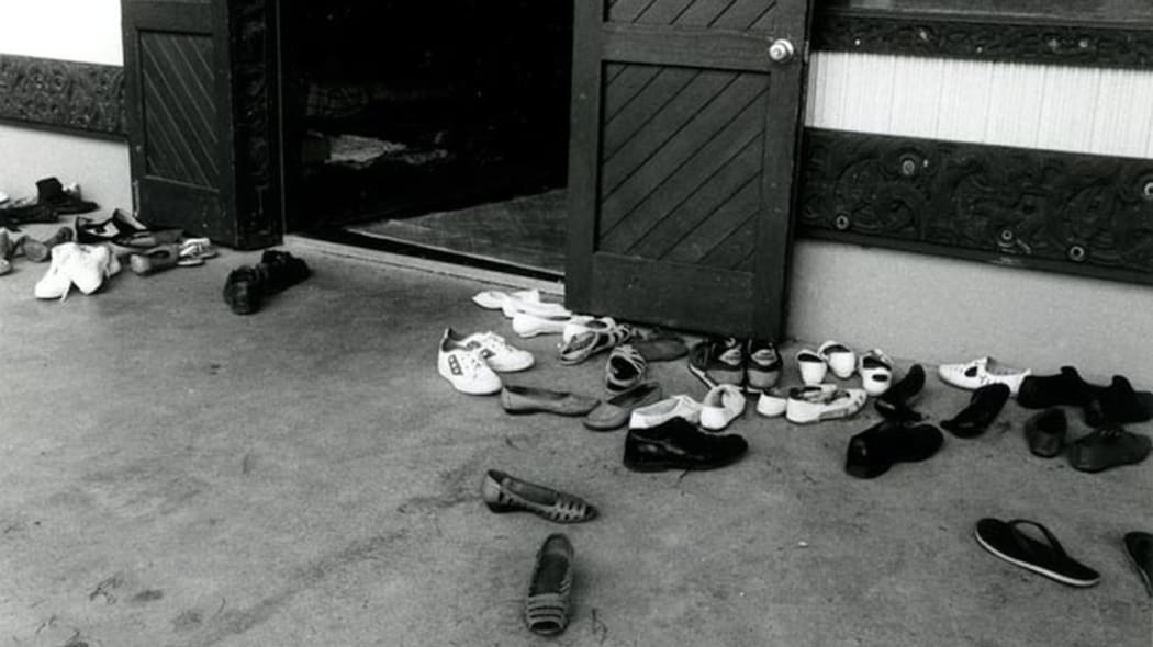 Shoes outside a wharenui at a marae