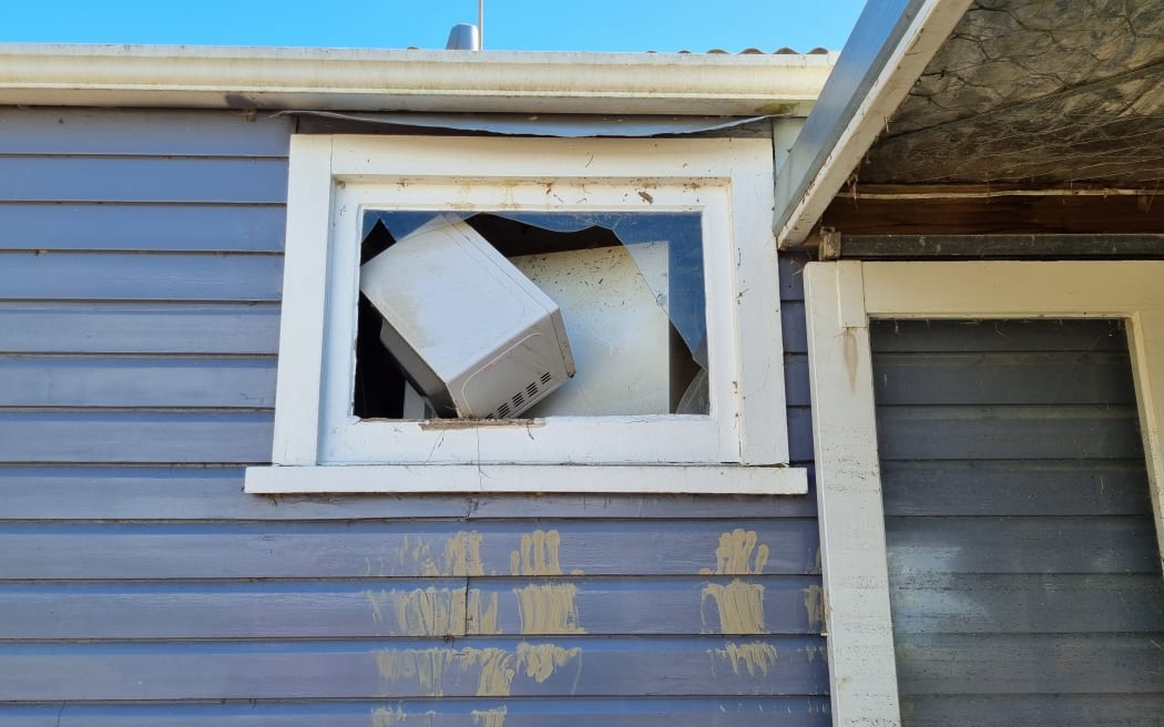 In Gary Spence's Pakowai home the fridge ended up on top of the stove, with the microwave wedged behind it up near the ceiling, as floodwaters from Cyclone Gabrielle ripped through the house.