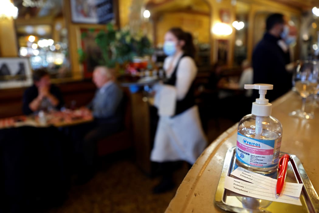 Hand sanitiser on the bar of a restaurant in Paris, where a four-week overnight curfew has been announced to fight the rapid spread of Covid-19. 14 October 2020.