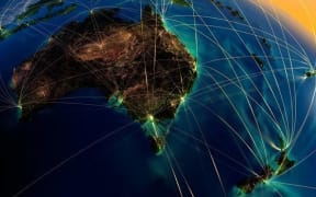 highly detailed planet earth at night with embossed continents, illuminated by light of cities, translucent and reflective ocean earth is surrounded by a luminous network, representing the major air routes based on real data