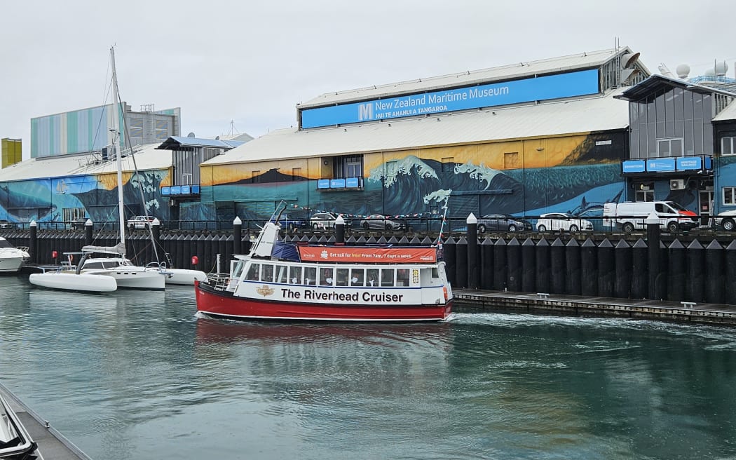 The red passenger ferry which has served as a bridge replacement, transporting people over the 100-metre distance between the Viaduct and Wynyard Quarter.