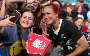 Ruby Tui with fans after the game.