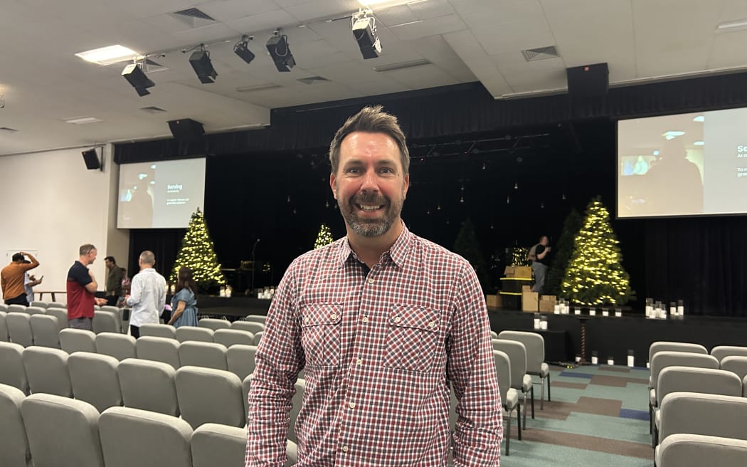 A man smiling at the camera.